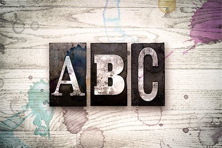 simsearch:400-08709089,k - The word "ABC" written in vintage, dirty metal letterpress type on a whitewashed wooden background with ink and paint stains. Foto de stock - Royalty-Free Super Valor e Assinatura, Número: 400-08709079