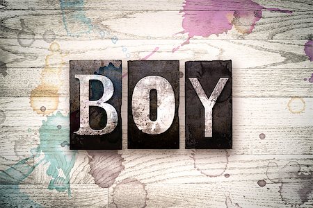 simsearch:400-08709089,k - The word "BOY" written in vintage, dirty metal letterpress type on a whitewashed wooden background with ink and paint stains. Foto de stock - Royalty-Free Super Valor e Assinatura, Número: 400-08709087