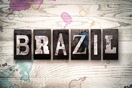 The word "BRAZIL" written in vintage, dirty metal letterpress type on a whitewashed wooden background with ink and paint stains. Stock Photo - Budget Royalty-Free & Subscription, Code: 400-08709088