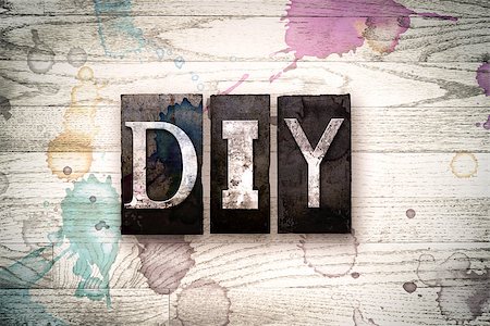 simsearch:400-08709089,k - The word "DIY" written in vintage, dirty metal letterpress type on a whitewashed wooden background with ink and paint stains. Stock Photo - Budget Royalty-Free & Subscription, Code: 400-08709096