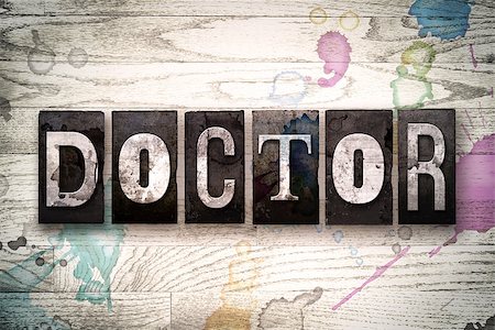 simsearch:400-08709089,k - The word "DOCTOR" written in vintage, dirty metal letterpress type on a whitewashed wooden background with ink and paint stains. Stock Photo - Budget Royalty-Free & Subscription, Code: 400-08709098