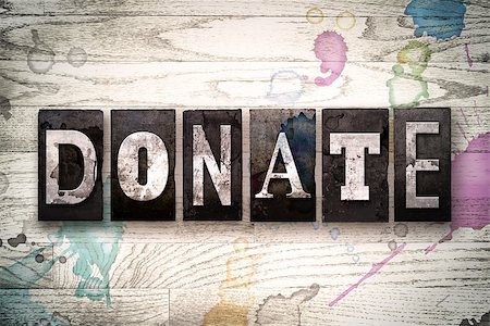 simsearch:400-08709089,k - The word "DONATE" written in vintage, dirty metal letterpress type on a whitewashed wooden background with ink and paint stains. Stock Photo - Budget Royalty-Free & Subscription, Code: 400-08709099