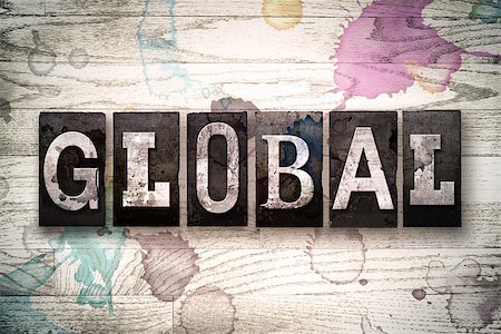 The word "GLOBAL" written in vintage, dirty metal letterpress type on a whitewashed wooden background with ink and paint stains. Stock Photo - Budget Royalty-Free & Subscription, Code: 400-08709114