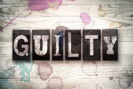 simsearch:400-08709089,k - The word "GUILTY" written in vintage, dirty metal letterpress type on a whitewashed wooden background with ink and paint stains. Stock Photo - Budget Royalty-Free & Subscription, Code: 400-08709123