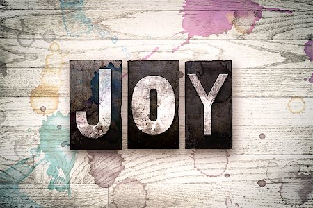simsearch:400-08709089,k - The word "JOY" written in vintage, dirty metal letterpress type on a whitewashed wooden background with ink and paint stains. Foto de stock - Royalty-Free Super Valor e Assinatura, Número: 400-08709137