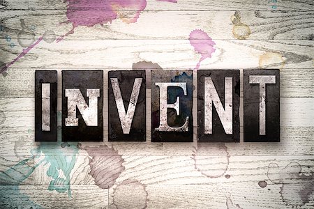 simsearch:400-08709089,k - The word "INVENT" written in vintage, dirty metal letterpress type on a whitewashed wooden background with ink and paint stains. Stock Photo - Budget Royalty-Free & Subscription, Code: 400-08709132