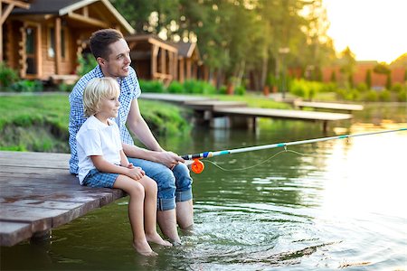 father and son fishing dock lake - Dad and son fishing outdoors Stock Photo - Budget Royalty-Free & Subscription, Code: 400-08729797