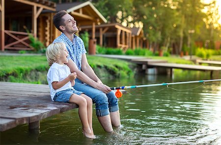 father and son fishing dock lake - Dad with son fishing outdoors Stock Photo - Budget Royalty-Free & Subscription, Code: 400-08729798