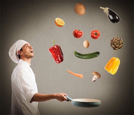 Surprised chef creates a smile jumping on pan vegetables Stock Photo - Budget Royalty-Free & Subscription, Code: 400-08729828