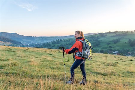 simsearch:400-06892091,k - Tourist with backpack standing on a rock Photographie de stock - Aubaine LD & Abonnement, Code: 400-08729936