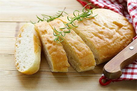 traditional Italian ciabatta bread on a wooden table Stock Photo - Budget Royalty-Free & Subscription, Code: 400-08734420