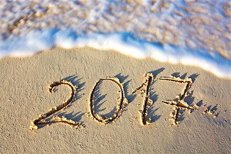 2017 inscription written in the wet beach sand with sea water wave. Stock Photo - Budget Royalty-Free & Subscription, Code: 400-08734492