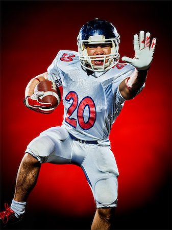 simsearch:400-08787080,k - one american football player man isolated on colorful black background Foto de stock - Super Valor sin royalties y Suscripción, Código: 400-08734511