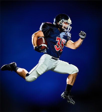 simsearch:400-08787080,k - one american football player man isolated on colorful black background Foto de stock - Super Valor sin royalties y Suscripción, Código: 400-08734513