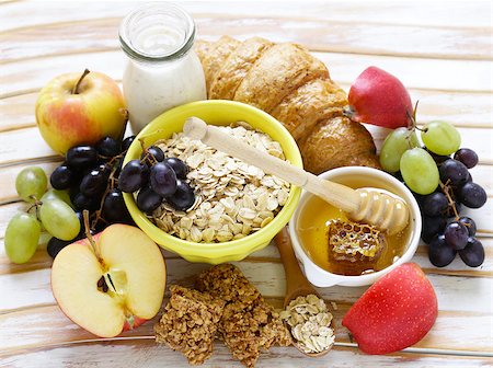 porridge bowl - set of products for a healthy breakfast, oatmeal, fruit, honey Stock Photo - Budget Royalty-Free & Subscription, Code: 400-08734793