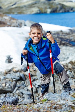 simsearch:400-08074589,k - Best Norway hike. Cute boy with hiking equipment in the mountains Stockbilder - Microstock & Abonnement, Bildnummer: 400-08735094