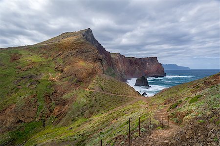 steffus (artist) - Walking path through the cliffs, mountains and hills in the virgin nature of Madeira east coast. Madeira island, Portugal. Fotografie stock - Microstock e Abbonamento, Codice: 400-08735366