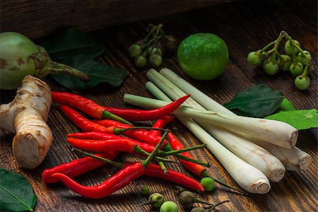 roots of aroma - Tom yam ingredients set for Thai cuisine on dark wooden table. Vegetable background Stock Photo - Budget Royalty-Free & Subscription, Code: 400-08735583