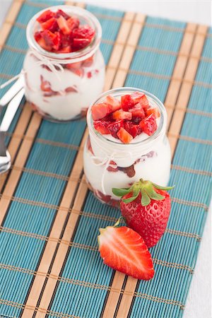 simsearch:400-08251879,k - Strawberries desert with cream served on glass cups over table top. Stock Photo - Budget Royalty-Free & Subscription, Code: 400-08735828
