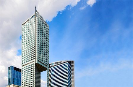 Top of modern skyscrapers and blue sky, copy space. Photographie de stock - Aubaine LD & Abonnement, Code: 400-08735881