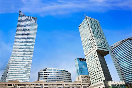 Modern skyscrapers in the city center. Blue sky, sunny day. Warsaw, Poland. Stock Photo - Budget Royalty-Free & Subscription, Code: 400-08735882