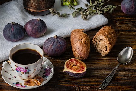 simsearch:400-08334670,k - Cup of coffee with fresh bread and some ripe figs on wooden surface Stock Photo - Budget Royalty-Free & Subscription, Code: 400-08736042