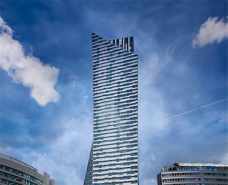 Modern residential skyscraper at dark blue sky. Copy space. Photographie de stock - Aubaine LD & Abonnement, Code: 400-08736239