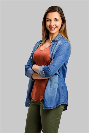 student latino business casual - Beautiful woman standing with hands folded over a gray background Stock Photo - Budget Royalty-Free & Subscription, Code: 400-08736487