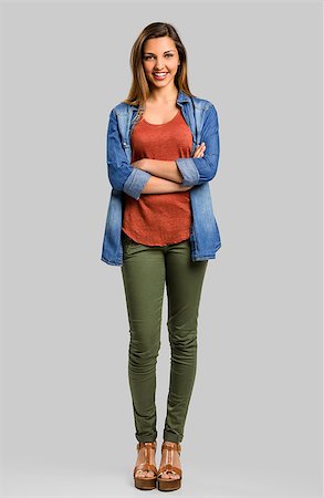 student latino business casual - Beautiful woman standing with hands folded over a gray background Stock Photo - Budget Royalty-Free & Subscription, Code: 400-08736488