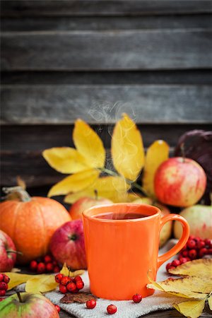 Orange mug on autumn background -fall leaves, apples, pumpkin and rowan-berry Stock Photo - Budget Royalty-Free & Subscription, Code: 400-08736516