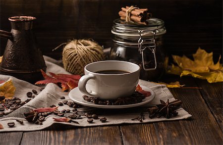 Cup of coffee at autumn evening. Some ingredients, spices and some kitchenware Stock Photo - Budget Royalty-Free & Subscription, Code: 400-08737127
