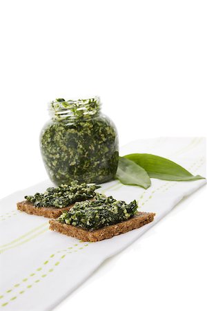 simsearch:400-04418942,k - Culinary healthy eating, spring detox. Garlic pesto in glass jar with fresh wild garlic leaves isolated on white background. Stockbilder - Microstock & Abonnement, Bildnummer: 400-08737350