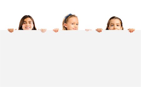 Cute litle girls holding a big white board with copyspace. Stock Photo - Budget Royalty-Free & Subscription, Code: 400-08730070