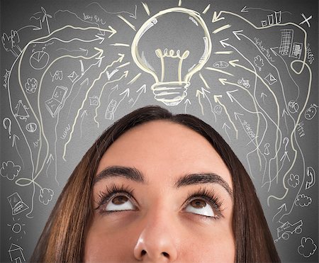 Woman with light bulb and business drawings above her head Foto de stock - Super Valor sin royalties y Suscripción, Código: 400-08730109