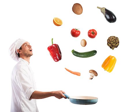 Surprised chef creates a smile jumping on pan vegetables Stock Photo - Budget Royalty-Free & Subscription, Code: 400-08730124