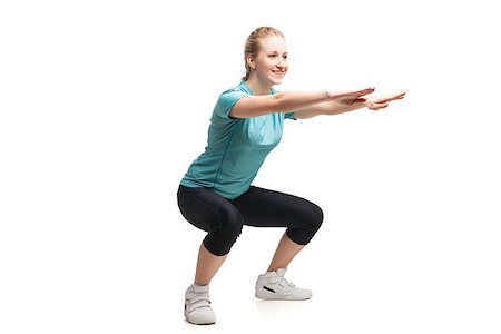 Beautiful sporty woman doing exercise . Isolated on white background Stock Photo - Budget Royalty-Free & Subscription, Code: 400-08730804