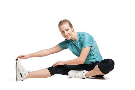 Beautiful sporty woman doing exercise on the floor. Isolated on white background Stock Photo - Budget Royalty-Free & Subscription, Code: 400-08730805