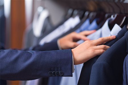 fashion store manager - Male hand choosing a shirt Stock Photo - Budget Royalty-Free & Subscription, Code: 400-08730886