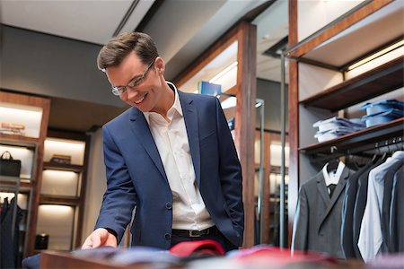 fashion store manager - Smiling businessman in store Stock Photo - Budget Royalty-Free & Subscription, Code: 400-08731175