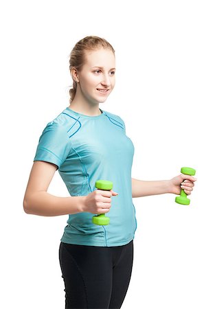 Athletic young woman works out with green dumbbells, isolated on white Fotografie stock - Microstock e Abbonamento, Codice: 400-08731316