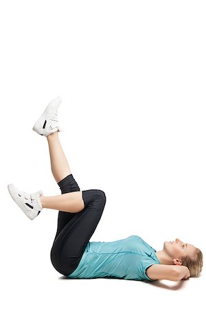 Beautiful sporty woman doing exercise on the floor. Isolated on white background Fotografie stock - Microstock e Abbonamento, Codice: 400-08731318