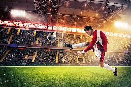 simsearch:400-09032117,k - Football player kicks the ball in the field of a stadium Foto de stock - Super Valor sin royalties y Suscripción, Código: 400-08731325