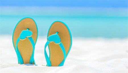 Flip Flops with hearts on a sandy ocean beach Stock Photo - Budget Royalty-Free & Subscription, Code: 400-08731833