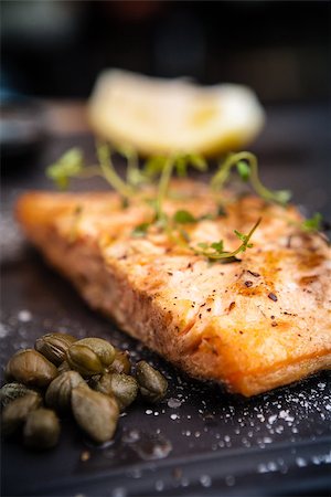 simsearch:400-09119781,k - Salmon steak served with pomegranate sauce on a warm plate Stock Photo - Budget Royalty-Free & Subscription, Code: 400-08731954