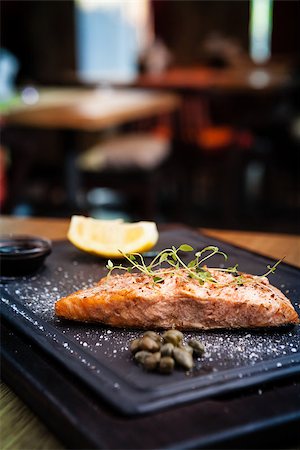 simsearch:400-09119781,k - Salmon steak served with pomegranate sauce on a warm plate Stock Photo - Budget Royalty-Free & Subscription, Code: 400-08731953
