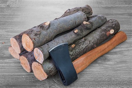 simsearch:400-05036060,k - stack of firewood logs and axe on a wooden surface Stock Photo - Budget Royalty-Free & Subscription, Code: 400-08732157