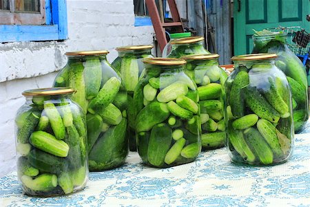 pickling gherkin - cucumbers in the glass jars are prepared for preservation Stock Photo - Budget Royalty-Free & Subscription, Code: 400-08732388