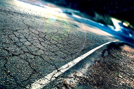 simsearch:400-04240814,k - Travel concept. Cracked asphalt and curve road.Road lines Stock Photo - Budget Royalty-Free & Subscription, Code: 400-08732529