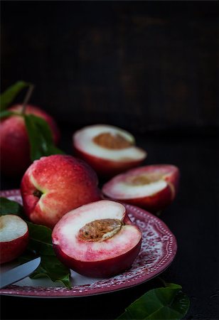 Plate of fresh nectarines on dark background Stock Photo - Budget Royalty-Free & Subscription, Code: 400-08732591