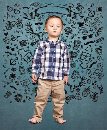 fashion kid with bicycle - little baby boy looking for idea Stock Photo - Budget Royalty-Free & Subscription, Code: 400-08732657
